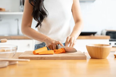 closeup-image-woman-slicing-carrots-260nw-2478106303.png
